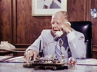 OFFSIDE: THE HAROLD BALLARD STORY, a hockey documentary directed and narrated by Jason Priestley. Harold Ballard in his office at Maple Leaf Gardens talking on phone. Courtesy of CBC