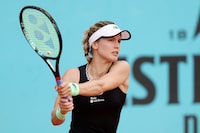 MADRID, SPAIN - APRIL 28: Eugenie Bouchard of Canada plays a backhand against Martina Trevisan of Italy during the Men's Singles second round match on Day Five of the Mutua Madrid Open at La Caja Magica on April 28, 2023 in Madrid, Spain. (Photo by Clive Brunskill/Getty Images)