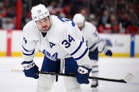 Toronto Maple Leafs center Auston Matthews (34) looks on in the second period of an NHL hockey game against the Washington Capitals, Wednesday, March 20, 2024, in Washington. (AP Photo/Nick Wass)