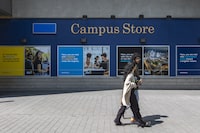 Pedestrians cross by the Toronto Metropolitan University Campus Store on Thursday, May 18, 2023. Tuan Minh Nguyen/ The Globe and Mail 






