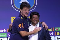 FILE - Fernando Diniz, left, the new head coach of the Brazil's national soccer team, and Brazilian Soccer Confederation President Ednaldo Rodrigues, right, embrace during a media presentation in Rio de Janeiro, Brazil, July 5, 2023. A Rio de Janeiro state court has removed Rodrigues from office because of irregularities in the proceedings that led to his election last year. (AP Photo/Silvia Izquierdo, File)