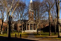 FILE — A pedestrian walks through Harvard University’s campus in Cambridge, Mass. on Dec. 12, 2023. Mark Zuckerberg, head of Meta, and Bill Ackman, head of the Pershing Square hedge fund, failed a push to get dissident candidates onto the Harvard Board of Overseers, one of the university’s two governing bodies. (Adam Glanzman/The New York Times)