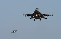 FILE - U.S. Air Force F-16 fighter jets fly over the Osan U.S. Air Base during a combined air force exercise with the United States and South Korea in Pyeongtaek, South Korea, Dec. 4, 2017. The U.S. has once again buckled under pressure from European allies and Ukraine's leaders and agreed to provide more sophisticated weapons to the war effort. This time it's all about F-16 fighter jets. (AP Photo/Ahn Young-joon, File)