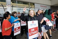 Lana Payne, Unifor National president, alongside workers at a picket line outside a Metro grocery store in Toronto as workers rejected a tentative deal triggering a strike of nearly 3,700 grocery store workers in the Greater Toronto Area, Saturday, July 29, 2023. THE CANADIAN PRESS/Cole Burston