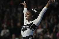 Simone Biles reacts after performing in the floor exercise at the U.S. Classic gymnastics competition Saturday, Aug. 5, 2023, in Hoffman Estates, Ill. (AP Photo/Erin Hooley)