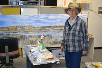 Dorothy Knowles with her painting Tangled Weeds (1983), May 2015.
Image courtesy The Gallery/art placement inc. Artwork copyright Estate of Dorothy Knowles Perehudoff.