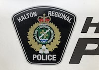 A Halton Regional Police logo is shown on a vehicle in Oakville, Ont., Wednesday, Jan.18, 2023.&nbsp;Ontario's police watchdog says it's launched an investigation after a man was allegedly shot and killed by police at a home in Oakville, Ont. The Special Investigations Unit says Halton Regional Police were called to the home west of Toronto shortly before 2 a.m. Saturday for reports of a stabbing. THE CANADIAN PRESS/Richard Buchan