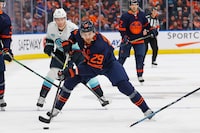 Jan 18, 2024; Edmonton, Alberta, CAN; Edmonton Oilers forward Leon Draisaitl (29) looks to make a pass in front of Seattle Kraken forward Andre Burakovsky (95) during the third period at Rogers Place. Mandatory Credit: Perry Nelson-USA TODAY Sports