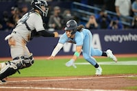 May 16, 2023; Toronto, Ontario, CAN; Toronto Blue Jays shortstop Bo Bichette (11)  slides into home plate on a single hit by Toronto Blue Jays first baseman Vladimir Guerrero Jr.  (not pictured) against the New York Yankees during the fifth inning at Rogers Centre. Mandatory Credit: John E. Sokolowski-USA TODAY Sports