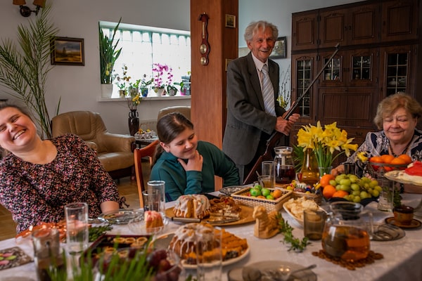 Mr. Krolicki and his wife, Teresa Krolicka share a meal with Ms. Voronetska and her daughter Anastasia on Easter Sunday. Mr. Krolicki shows off his air rifle and promises Anastasia that he will teach her to shoot.