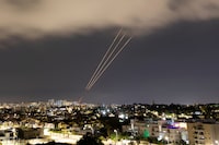FILE PHOTO: An anti-missile system operates after Iran launched drones and missiles towards Israel, as seen from Ashkelon, Israel April 14, 2024. REUTERS/Amir Cohen/File Photo