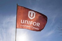 The Unifor logo is displayed on a flag outside the Toyota plant in Cambridge, Ont. on March 31, 2014.
