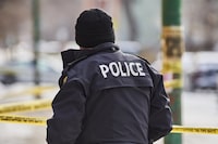 Police secure a crime scene in Winnipeg on Sunday, Nov. 26, 2023.&nbsp;A woman in Winnipeg was allegedly shot in the face with an air pistol by a stranger sitting next to her at a bar. THE CANADIAN PRESS/David Lipnowski
