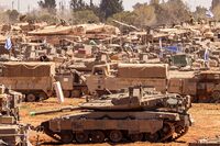 Israeli army battle tanks and military vehicles take position in southern Israel near the border with the Gaza Strip on May 8, 2024, amid the ongoing conflict in the Palestinian territory between Israel and the Hamas movement. (Photo by Jack Guez / AFP) (Photo by JACK GUEZ/AFP via Getty Images)