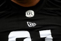 The CFL free agency process will kick into high gear Sunday. That's when the league's free-agency window will open and CFL teams will be able to talk freely with any pending free agents or their representatives. The CFL logo is seen on a jersey in Ottawa on Thursday, May 19, 2022. THE CANADIAN PRESS/Justin Tang