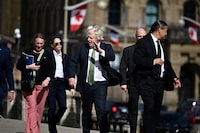 Former Prime Minister of the United Kingdom Boris Johnson waves as he makes his way towards West Block on Parliament Hill in Ottawa, on Wednesday, April 10, 2024. Johnson will participate in a keynote at the Canada Strong and Free Networking Conference on Wednesday night. THE CANADIAN PRESS/Justin Tang