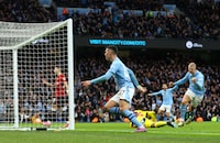 Soccer Football - Premier League - Manchester City v Manchester United - Etihad Stadium, Manchester, Britain - March 3, 2024 Manchester City's Phil Foden celebrates scoring their second goal with Erling Braut Haaland REUTERS/Carl Recine