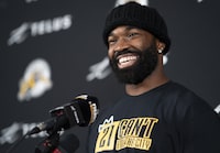 Hamilton Tiger Cats linebacker Simoni Lawrence (21) speaks during a media availability in Hamilton, Ont., Monday, Nov. 6, 2023. It's the end of an era for the Tiger-Cats. Star linebacker Lawrence announced his retirement from football Thursday.THE CANADIAN PRESS/Peter Power
