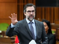 Minister of Environment and Climate Change Steven Guilbeault rises during question period in the House of Commons on Parliament Hill in Ottawa on Friday, Feb. 16, 2024. THE CANADIAN PRESS/Sean Kilpatrick
