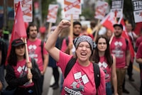 Participants chant as they march through Toronto during the Labour Day Parade on Monday, September 5, 2022. THE CANADIAN PRESS/ Tijana Martin