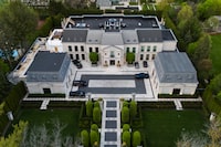 An aerial view shows the home of Canadian rapper Drake in Toronto, Canada, on May 7, 2023. Police in Toronto were investigating a pre-dawn shooting on on May 7 at the sprawling estate of superstar rapper Drake, located in one of Canada's most exclusive neighborhoods. A security guard was standing outside the massive wrought iron gates at the entrance to the rapper's mansion on The Bridle Path road north of downtown Toronto when suspects in a vehicle opened fire, police said. (Photo by Christopher Katsarov Luna / AFP) (Photo by CHRISTOPHER KATSAROV LUNA/AFP via Getty Images)
