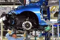 (FILES) An employee of Toyota Motors assembles FCV "Mirai" on its assembly line during the vehicle's line off ceremony at the Motomachi factory in Toyota city, Aichi prefecture on February 24, 2015. Toyota said on August 29, 2023 it halted operations at 12 of its 14 factories in Japan due to a system glitch, but that it did not appear to be a cyberattack. (Photo by Toshifumi KITAMURA / AFP) (Photo by TOSHIFUMI KITAMURA/AFP via Getty Images)