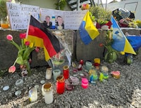 Flowers and candles are placed at the scene, as residents mourn the death of two Ukrainian soldiers in the small southern town of Murnau, Germany, April 29, 2024. The two soldiers were on rehabilitation in Germany and allegedly stabbed on Saturday, April 27, 2024 by a Russian in front of a shopping centre, according to the Ukrainian Foreign Ministry. The suspect was arrested by German police shortly after the stabbing.    REUTERS/Christine Uyanik/File Photo