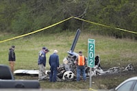 Investigators look over a small plane crash alongside eastbound Interstate 40 at mile marker 202 on Tuesday, March 5, 2024, in Nashville, Tenn. U.S. authorities continue to investigate a plane crash in Tennessee that killed five Canadians. THE CANADIAN PRESS/AP, George Walker IV