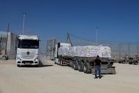 A truck carrying humanitarian aid for the Gaza Strip waits as another truck exits a gate, amid the ongoing conflict between Israel and the Palestinian Islamist group Hamas, at Erez Crossing in southern Israel, May 5, 2024. REUTERS/Amir Cohen