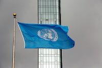 FILE - The UN flag flies on a stormy day at the United Nations during the United Nations General Assembly on Thursday, Sept. 22, 2022. A U.N. official says the eight peacekeepers have been suspended and detained in eastern Congo on allegations of sexual exploitation. The United Nations said on Wednesday, Oct. 11, 2023 that it has taken “strong measures in response to reports of serious misconduct by peacekeepers.” The peacekeepers have been confined pending further details and a full investigation.  (AP Photo/Ted Shaffrey, File)