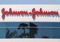 (FILES) In this file photo taken on August 28, 2019 A sign on a building at the Johnson & Johnson campus shows their logo in Irvine, California. - Johnson & Johnson proposes $8.9 billion settlement of talc cancer claims. (Photo by Mark RALSTON / AFP) (Photo by MARK RALSTON/AFP via Getty Images)