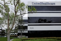 FILE PHOTO: The corporate logo of the UnitedHealth Group appears on the side of one of their office buildings in Santa Ana, California, U.S., April 13, 2020. REUTERS/Mike Blake/File Photo