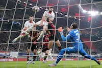Leipzig's Croatian defender Josko Gvardiol (3rd L) gets up to score the 1-1 goal with his head during the UEFA Champions League round of 16, first-leg football match between RB Leipzig and Manchester City in Leipzig, eastern Germany on February 22, 2023. (Photo by RONNY HARTMANN / AFP) / ALTERNATIVE CROP (Photo by RONNY HARTMANN/AFP via Getty Images)