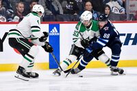 <div>Wyatt Johnston scored a goal and an assist and goalie Jake Oettinger stood tall as the Dallas Stars defeated the Jets (3-2) on Saturday afternoon. Winnipeg Jets' Nate Schmidt (88) fights for possession of the puck against Dallas Stars' Miro Heiskanen (4) and Johnston (53) during second period NHL action in Winnipeg, Saturday, Nov. 11, 2023. THE CANADIAN PRESS/Fred Greenslade</div>
