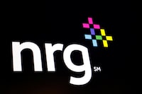 NRG Energy Inc. logo is displayed on a screen on the floor of the New York Stock Exchange (NYSE) in New York, U.S., June 13, 2018. REUTERS/Brendan McDermid