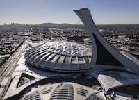 <p>An aerial view of Olympic Stadium in Montreal, Monday Feb. 5, 2024. Montreal's Olympic Park has launched an international competition to find a second life for its tattered old roof. THE CANADIAN PRESS/Christinne Muschi</p>