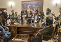 FILE - Taliban fighters take control of the Afghan presidential palace after Afghan President Ashraf Ghani fled the country, in Kabul, Afghanistan, on Aug. 15, 2021. Online abuse and hate speech targeting politically active women in Afghanistan has significantly increased since the Taliban took over the country in Aug. 2021, according to a report released Monday, Nov. 20, 2023 by a U.K.-based rights group. (AP Photo/Zabi Karimi, File)
