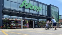 Shoppers at a west-end Toronto Sobeys grocery store, Sunday, June 26, 2023. The Canadian Chamber of Commerce says while consumer spending remained strong in the second quarter, it turned a corner after the Bank of Canada announced another interest rate hike in June. THE CANADIAN PRESS/Graeme Roy