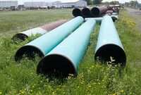 Pipeline used to carry crude oil sits at the Superior, Wis., terminal of Enbridge Energy, June 29, 2018