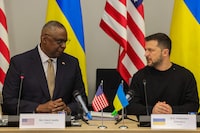 US Secretary Lloyd Austin (L) talks with President of Ukraine, Volodymyr Zelensky, during a Meeting of the Ukraine Defense Contact Group ahead of a 2 days NATO Defense Ministers Council at the alliance headquarters in Brussels, on October 11, 2023. (Photo by Olivier MATTHYS / POOL / AFP) (Photo by OLIVIER MATTHYS/POOL/AFP via Getty Images)