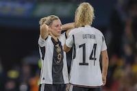 Germany's Svenja Huth, left, and Lena Lattwein react following the Women's World Cup Group H soccer match between South Korea and Germany in Brisbane, Australia, Thursday, Aug. 3, 2023. (AP Photo/Aisha Schulz)