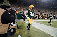 Green Bay Packers linebacker Quay Walker leaves the field after being ejected during the second half of an NFL football game against the Detroit Lions Sunday, Jan. 8, 2023, in Green Bay, Wis. (AP Photo/Morry Gash)