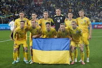 Ukraine squad pose before the Euro 2024 group C qualifying soccer match between Ukraine and Italy at the BayArena in Leverkusen, Germany, Monday, Nov. 20, 2023. (AP Photo/Martin Meissner)