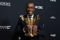 Clement Virgo clutches awards for "Best Motion Picture" "Achievement in Direction" and "Adapted Screenplay" for the movie "Brother" at the Cinematic Arts Awards evening at the Canadian Screen Awards, in Toronto, on Thursday, April 13, 2023. THE CANADIAN PRESS/Chris Young 
