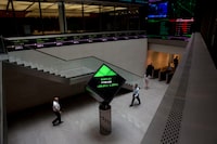 Financial information is displayed on screens and a ticker inside the London Stock Exchange in the City of London on Tuesday, Aug.25, 2015. Newfoundland and Labrador says it is looking to European markets to better finance its debt.
The province has listed $1 billion euros in bonds on the London Stock Exchange in hopes of attracting lower interest rates. THE CANADIAN PRESS/AP/Matt Dunham