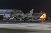 In this image provided on Friday Jan. 12, 2024 by the U.K. Ministry of Defence an RAF Typhoon aircraft returns to base at RAF Akrotiri in Cyprus, after striking targets in Yemen. The U.S. and British militaries bombed more than a dozen sites used by the Iranian-backed Houthis in Yemen late on Thursday Jan. 11, in a massive retaliatory strike using warship- and submarine-launched Tomahawk missiles and fighter jets, U.S. officials said. THE CANADIAN PRESS/Sgt Lee Goddard, UK Ministry of Defence via AP