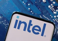 FILE PHOTO: A smartphone with a displayed Intel logo is placed on a computer motherboard in this illustration taken March 6, 2023. REUTERS/Dado Ruvic/Illustration/File Photo
