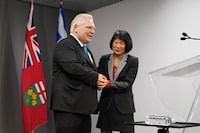 Ontario Premier Doug Ford, left, and Toronto Mayor Olivia Chow, right, shake hands following a press conference regarding housing development at Toronto City Hall, in Toronto on Thursday, Feb. 22, 2024. THE CANADIAN PRESS/Arlyn McAdorey