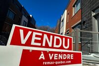 A "sold" sign is shown in a new housing development in Lasalle, a borough of Montreal, Monday, Feb. 19, 2024. 
The Quebec Professional Association of Real Estate Brokers says Montreal-area home sales surged 25.5 per cent in April compared with the same month last year, with levels returning to historical averages for this time of year.THE CANADIAN PRESS/Christinne Muschi