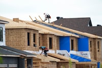 The Canada Mortgage and Housing Corp. is forecasting that real estate prices could match peak levels seen in early 2022 by next year and reach new highs by 2026. New homes are constructed in Ottawa on Monday, Aug. 14, 2023.THE CANADIAN PRESS/Sean Kilpatrick